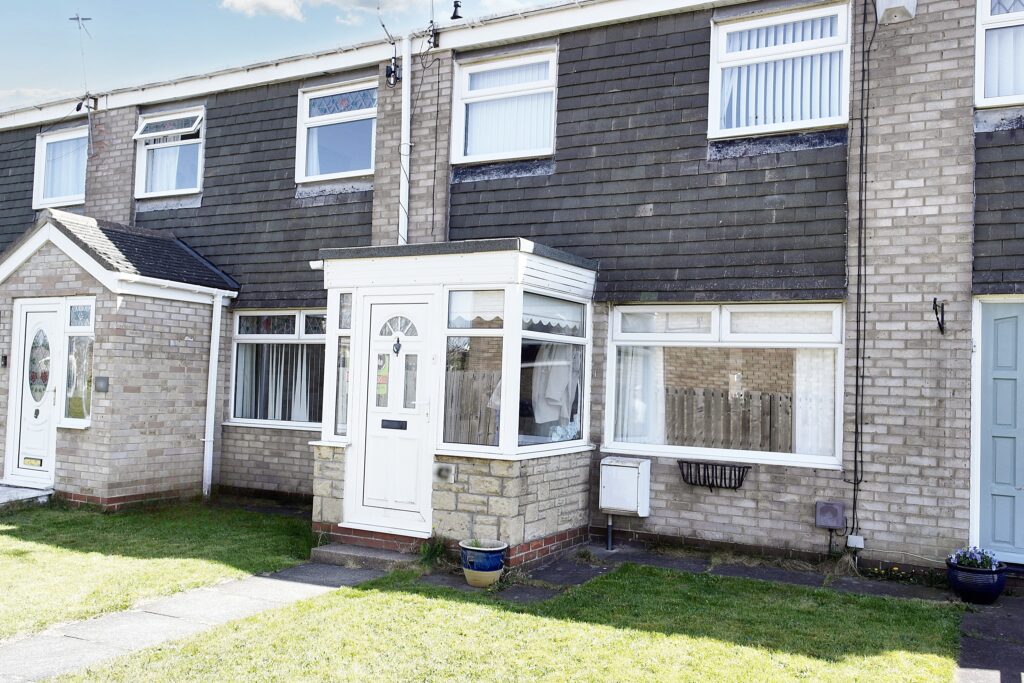 Terraced house for sale by Spartan Property Estate Agents, showcasing front garden and bay window.